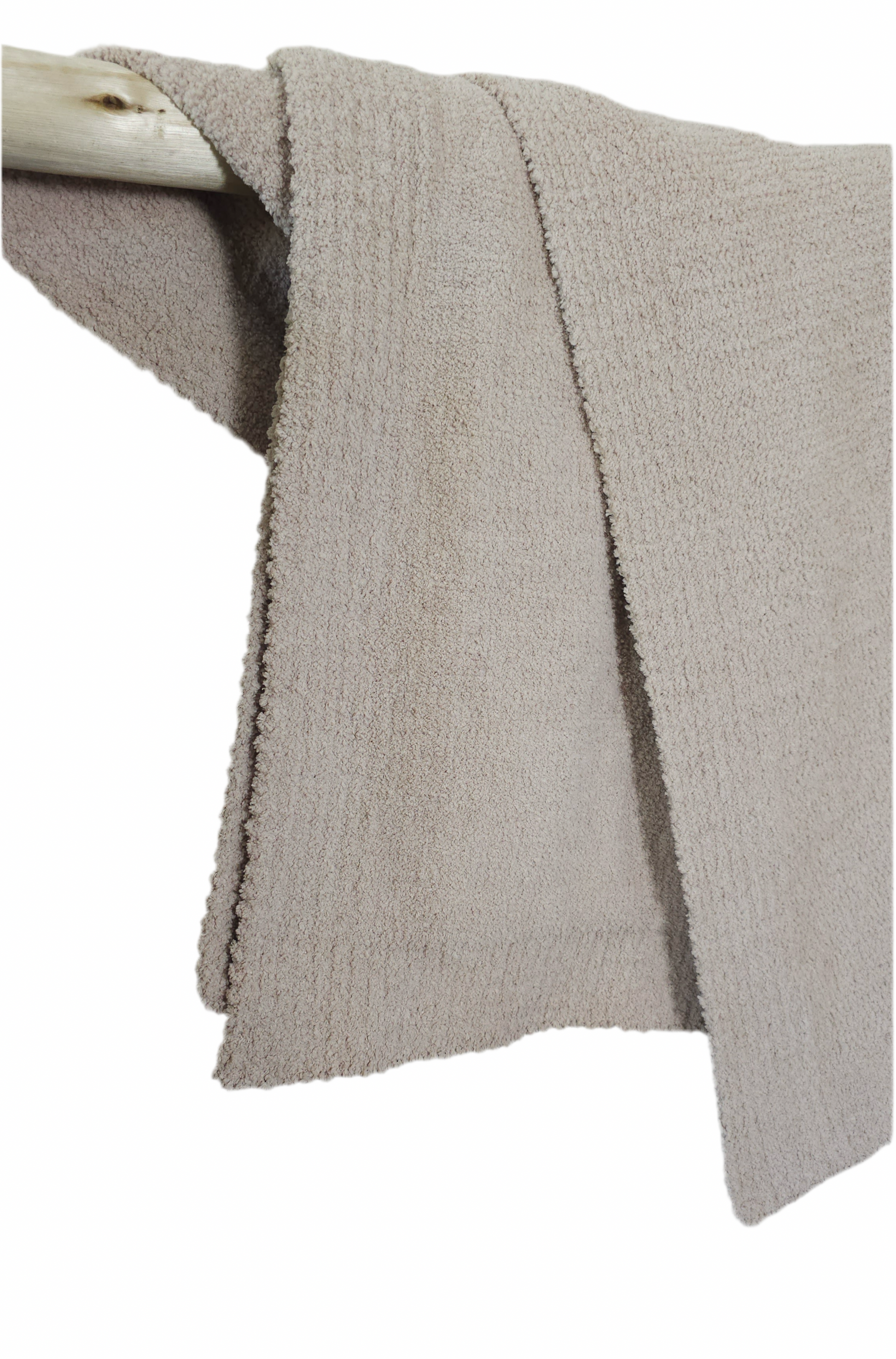 Sophisticated Fossil Greige Nest throw draped over driftwood, perfect for modern, understated luxury